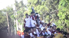 Chaotic scenes from Catholic festival as barefoot worshippers collapse