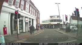 3 idiots on bicycles nearly run over a woman after breaking a red light. None of them attempted to even slow down