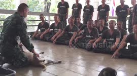 Soldiers does CPR demonstration on his pet dog