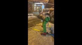 Drunk Man Struggles To Put Skis Back On After Heavy Apres Ski Sesh