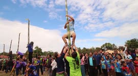 Bizarre bamboo pole climbing competition takes place in rural Thai village