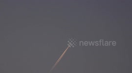 Two jet airplanes seem to be very close to each other.