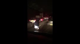kid does some shadow boxing stuck in traffic