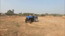 Daring men perform adventurous stunts on tractor