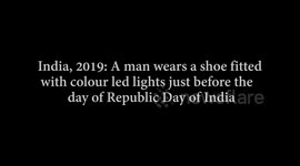 A man wears an interesting shoe lighted with a colourful led light