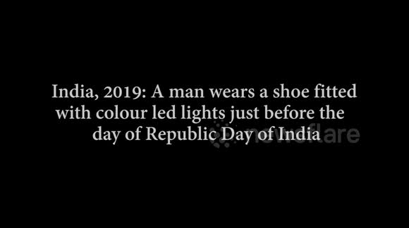 A man wears an interesting shoe lighted with a colourful led light