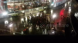 Jubilant Man Utd supporters dance outside Emirates Stadium