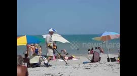 Metal detector guy gets pranked on the beach