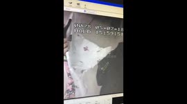 Moment pickpockets still ladies purse in London shop