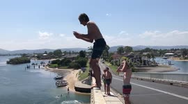 kid flipping off huge bridge