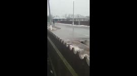 Old man skiing on frozen road