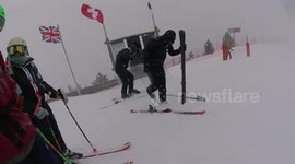 Skier cannot get their ski on because the binding is closed