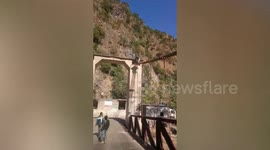 Man in India walks on bridge cables over 50-foot gorge for a £6 bet