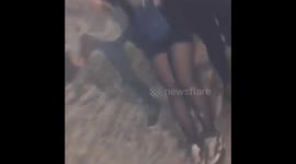 Drunk friend being carried and shocked at me for sneaking her drunk out.