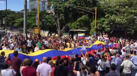 Citizens sing venezuelan National Anthem during a protest against Nicolas Maduro
