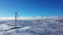 Drone View of Wind Turbines In Snow