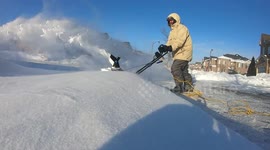 Toronto man tries out electric snowblower to keep his drive clear