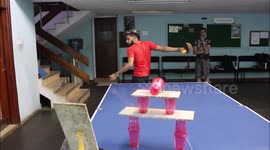 Blind behind the back trick shot into a cup