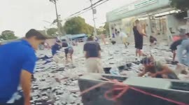 Over-turned truck that spilled 80,000 cans of beer sends locals into a looting frenzy