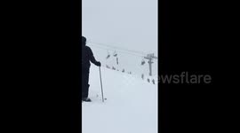 Mickey Wilson rescues his strangling friend by climbing chairlift tower and cable