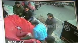 Drunk woman caught after falling from window in China