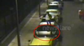 Drunk man runs along parked cars in China