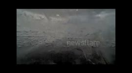 GoPro lowered under frozen lake gets fishy surprise