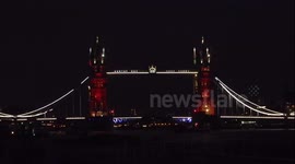 Tower bridge lit up in French flag colours