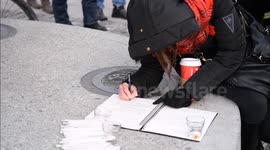 Hundreds of Torontonians converged on Nathan Philips Square 