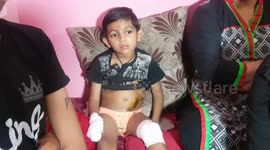 Miraculous escape as School van's back wheel passed over five years old boy in India.