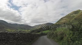 Driver Navigates Steep and Narrow Lanes In The Lake District