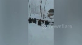 Pregnant women taken in stretcher due to Heavy snow fall in India.