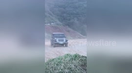 Hardtop Jeep turns into instant convertible after jump fail