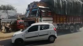 Longer Version: Demonic truck driver drags car down road for 3km with driver still inside it