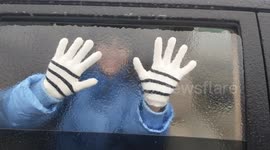 Freezing rain forms 'ice window' on car