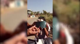 Blindfold on, Indian girl rides moped like a pro
