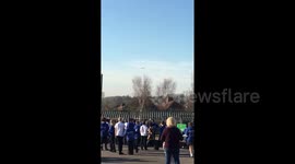 Excited school kids watch Airbus Beluga XL fly overhead north of Bristol