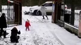 Boy playing snow on road gets crashed by car
