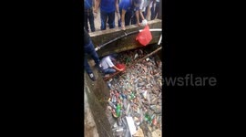 Stream filled with plastic bottles in Indonesia shows the devastating effect of pollution