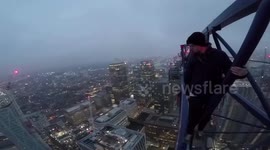 Two adrenaline junkies cheat death after climbing 784ft London skyscraper