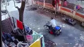 Dramatic footage shows girl run over by bike, escapes unhurt in central India