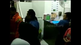 Firefighter unit rescues woman trapped in elevator in Indonesia