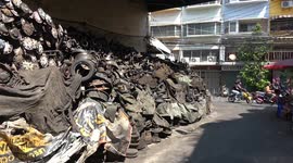 Huge pile of rusty car parts in the street