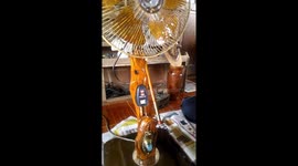 Inventive father makes fan from tree branch and rice cooker switch