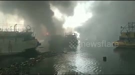 Smoke Billows From The Burned Fishermen Boats in Jakarta, Indonesia