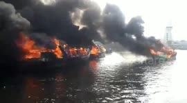 Fishing fleet completely destroyed in harbour fire in Indonesia