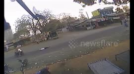 Chilling moment victim tries to stop robbers by latching on to their bike