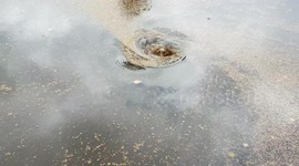 Whirling rain water rush downhill drive