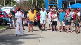 Elvis Presley Impersonator Sings All Shook Up at Auto Show for Charity