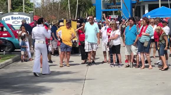 Elvis Presley Impersonator Sings All Shook Up at Auto Show for Charity